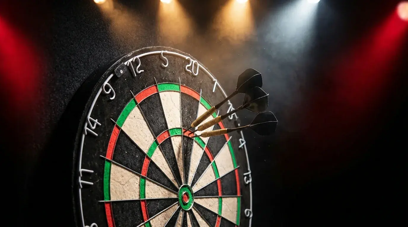 Professional darts board under stage lighting at a PDC tournament